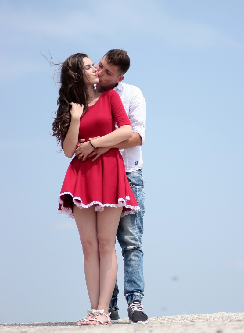 sky, day, affectionate, hairstyle, couple - Relationship, real people, casual clothing, dating, young Adult, standing, happiness, adult, kiss, 2K, summer