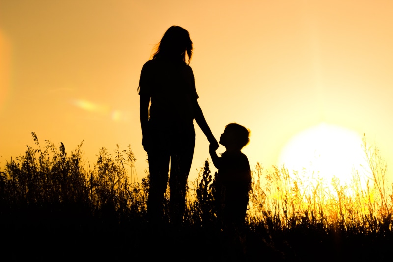 boys, grass, togetherness, men, walking, females, bonding, smiling, mother, adult, mom, woman, cheerful, women, sunlight, silhouette, two people, baby