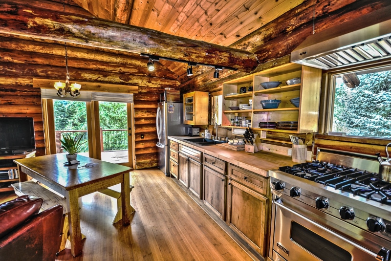 table, wood, vacation, built structure, rural, indoors, flooring, cottage, rectangular, cabin, chair, home, rustic, roof beam, country, no people, chalet