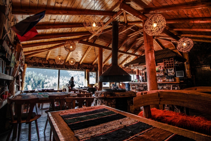 wood, day, table, housing, food, built structure, indoors, absence, seat, cafe, bench, food court, ceiling, countryside, person, bar - drink establishment