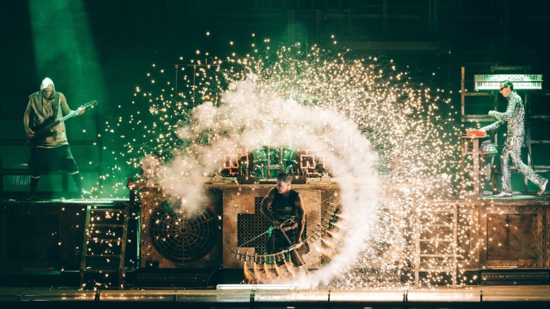 motion, firework display, illuminated, built structure, creativity, nature, smoke - physical structure, Till Lindemann, night, building exterior, arts culture and entertainment