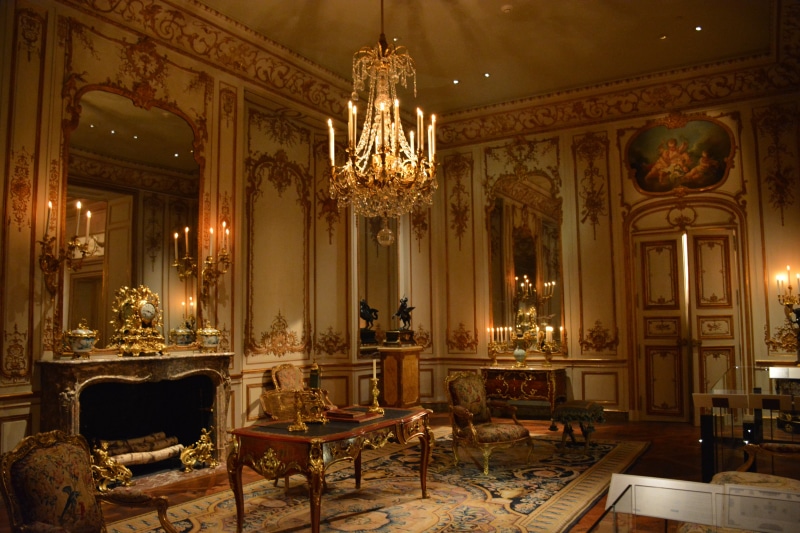 table, parlor, lighting equipment, carpet - decor, the past, illuminated, travel destinations, interiors, building, history, chandelier, living room, built structure