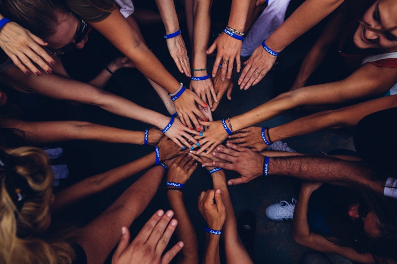 winning, togetherness, community, ethnicity, group, young Men, human Body Part, men, unity, happiness, females, wristband, hands, huddling, team, african Descent