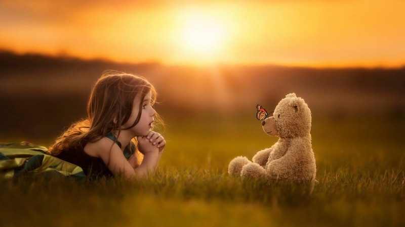 nature, sky, photography, innocence, bear, hair, children, outdoors, mammal, sunlight, offspring, plush, one person, toy, hairstyle, grass, child, girls