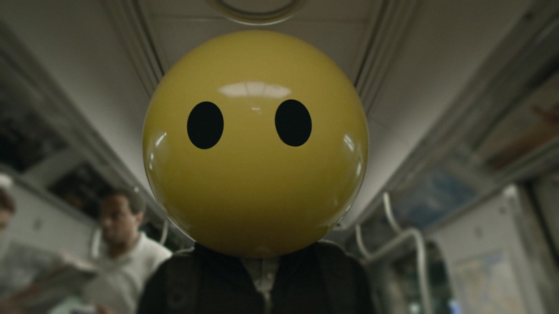 close-up, Mr. Robot, TV, balloon, no people, human representation, still life, anthropomorphic smiley face, Emoji, anthropomorphic, smiling, toy, focus on foreground