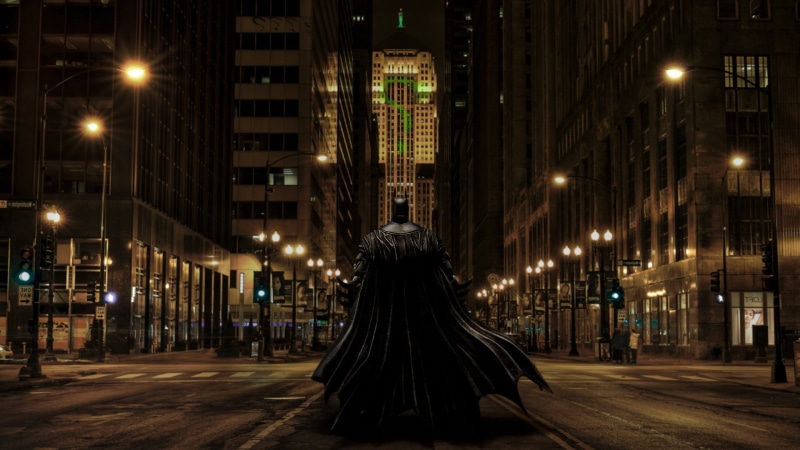 Photoshopped, one person, illuminated, leisure activity, city, The Dark Knight, real people, street, women, Chicago, rear view, walking, adult, Gotham City