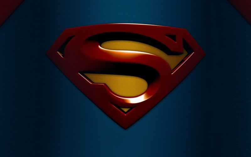 Superman, blue, 720P, blue background, logo, glowing, heart shape, close-up, no people, indoors, emotion, directly above, design, positive emotion, colored background