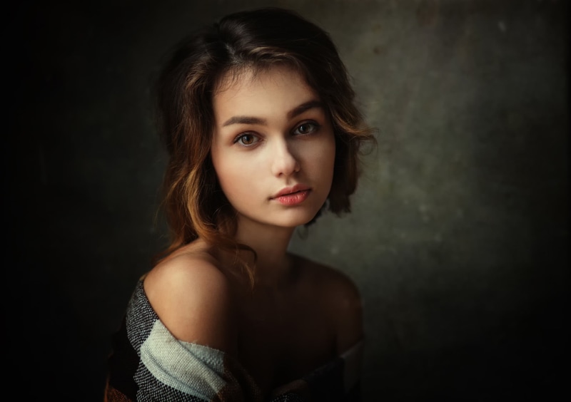 front view, long hair, portrait, one person, hairstyle, top, woman, contemplation, wearing, indoors, fashion, young adult, studio shot, adult, beautiful people