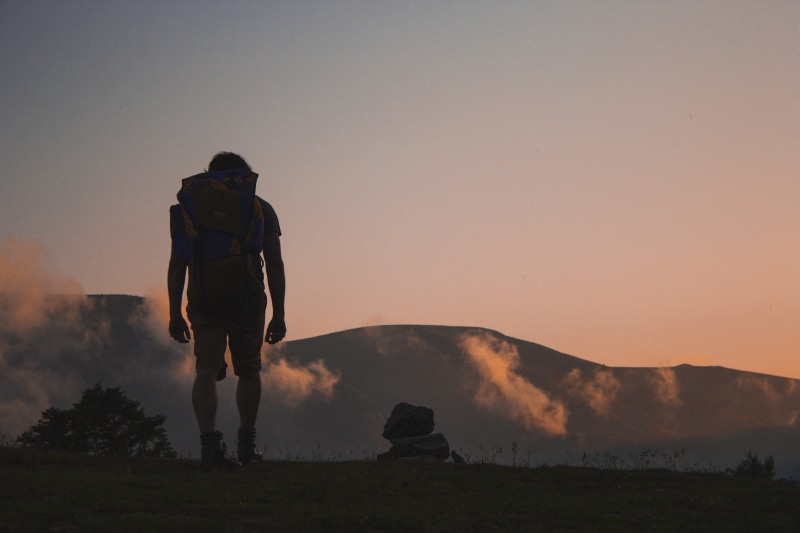 carrying, backpack, nature, silhouette, near, sky, along, rocks, landscape, hike, golden hour, walking on, walking, rear view, field, 5K, journey, backpacker