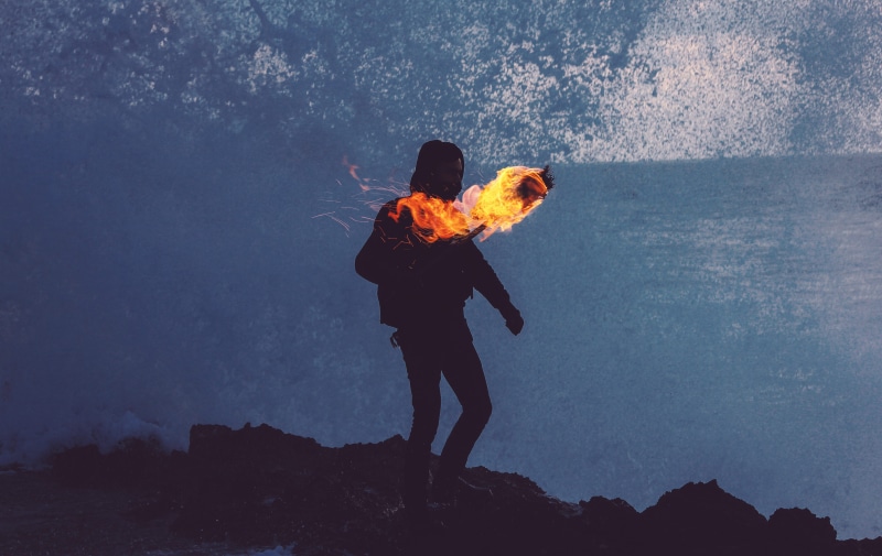 silhouette, outdoors, sky, carry, hiking, man, full length, standing, holding, men, heat - temperature, adult, torch, rock - object, burning, nature, fire - natural phenomenon