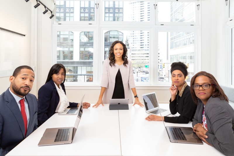wireless technology, business, group of people, using laptop, indoors, adult, meeting, standing, businessman, center, mature adult, room, conference room