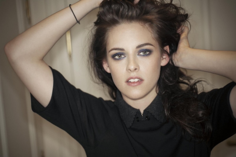 one person, young adult, hand in hair, real people, model, arms raised, women, black color, indoors, lifestyles, looking at camera, actor, stewart, human hair