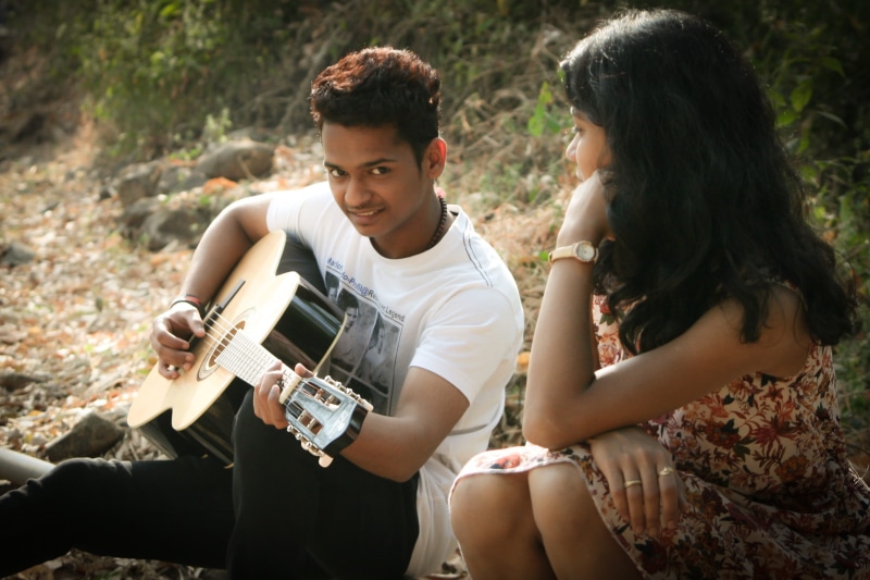 togetherness, man, song, happy, musician, teenager, india, couple in love, young, romance, young adult, girl, girlfriend, outdoors, leisure activity, couple - relationship