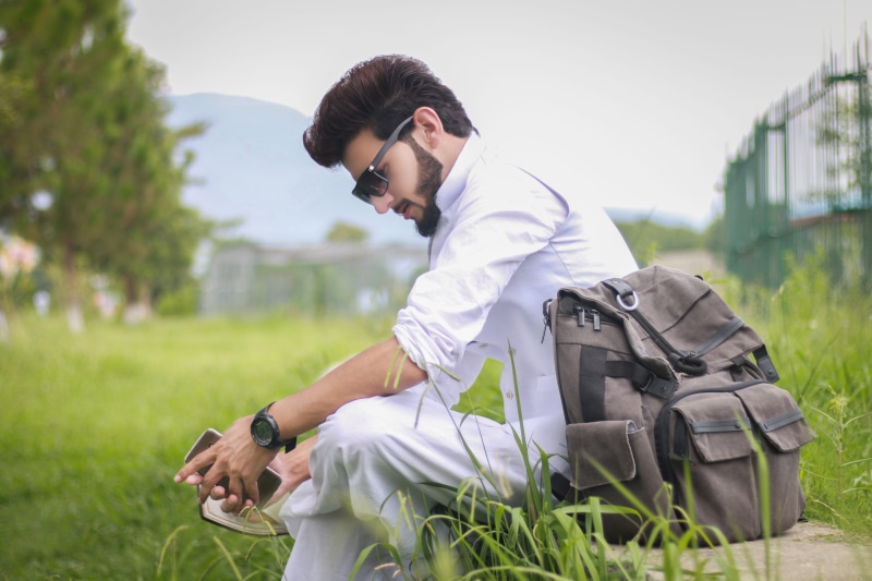 plant, three quarter length, 5K, real people, Pose, backpack, one person, young adult, adults only, adult, focus on foreground, beside, Style, one man only