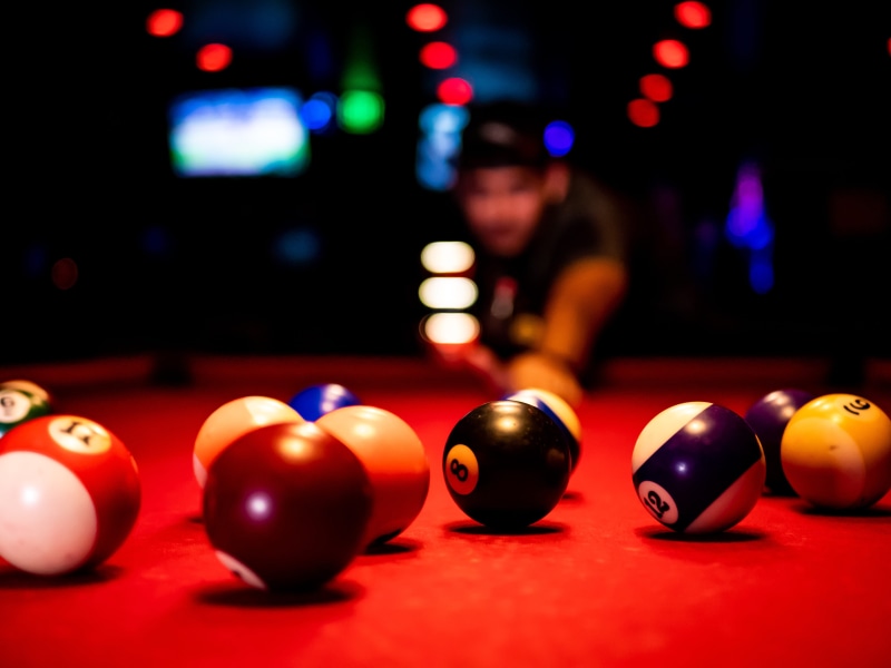scratch, bar, nightclub, arts culture and entertainment, green, nightlife, focus on foreground, sphere, recreational pursuit, one person, colorful, color