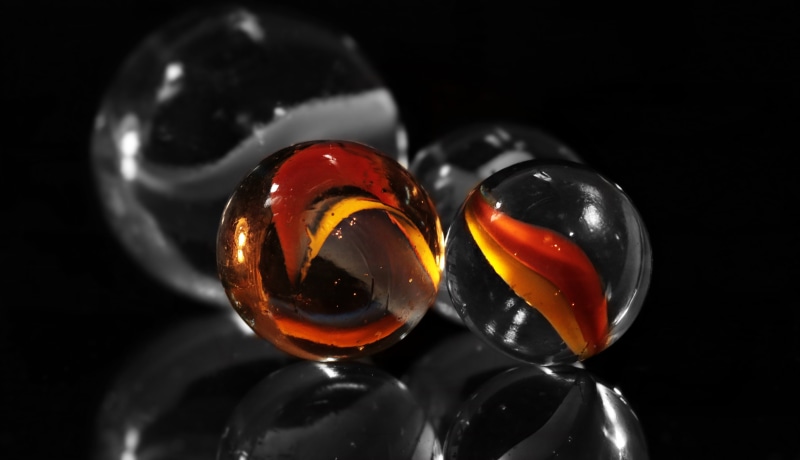 marbles, toys, balls, medium group of objects, indoors, glass - material, transparent, scrooge, about, s w, still life, glass, group of objects, studio shot