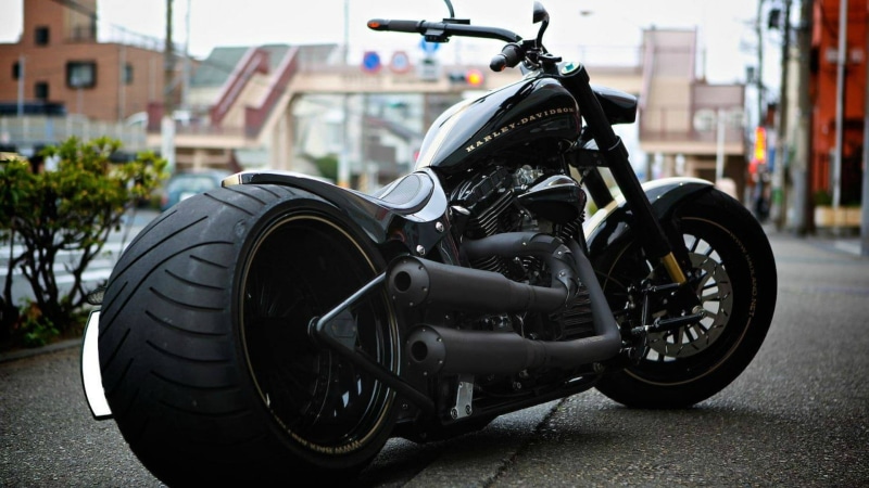 black, built structure, tire, architecture, land vehicle, mode of transportation, vehicle, black color, no people, road, focus on foreground, close-up