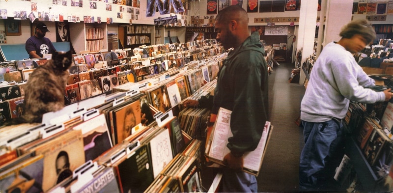 market, abundance, Music, people, retail, DJ Shadow, album covers, group of people, indoors, retail display, shelf, covers, sale, store, standing, eyes