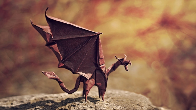 full length, animal, representation, wings, invertebrate, art and craft, dragon, focus on foreground, shadow, miniatures, stone, origami, depth of field