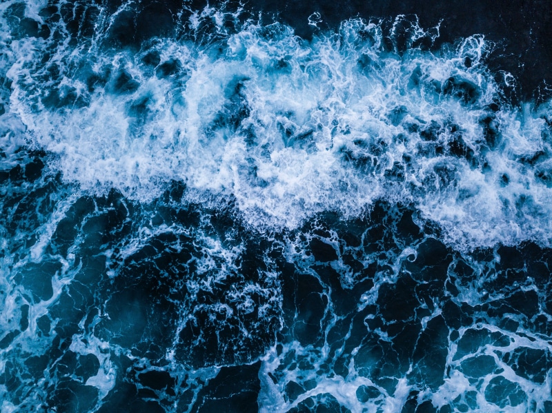 blue, full frame, sport, backgrounds, ocean, motion, sea, ripple, splashing, power in nature, flowing, high angle view, surf, water, wet, pattern, wave