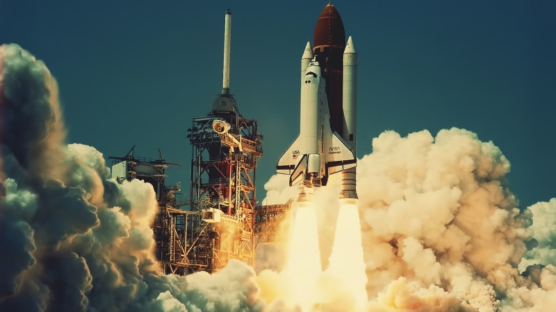 space shuttle, travel destinations, low angle view, building exterior, building, travel, sky, tall - high, rocket, day, tourism, no people, city, built structure