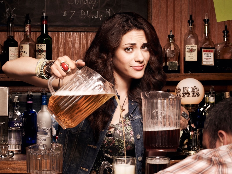 one person, indoors, clear, beauty, women, smiling, container, two, pitchers, beautiful woman, hairstyle, bartender, alcohol, refreshment, bar counter