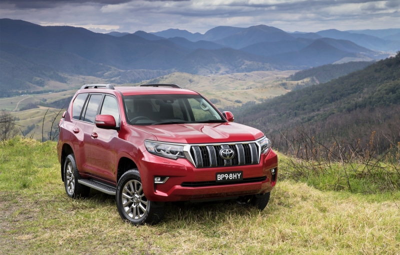no people, motor vehicle, 2K, non-urban scene, red, mountain, nature, beauty in nature, mountain range, day, suv cars, field, scenics - nature, grass