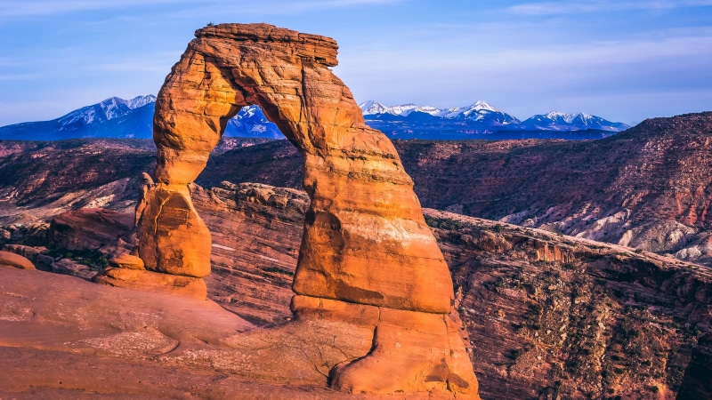 solid, travel destinations, nature, environment, arch, remote, rock - object, non-urban scene, arches national park, outdoors, mountain range, scenics - nature