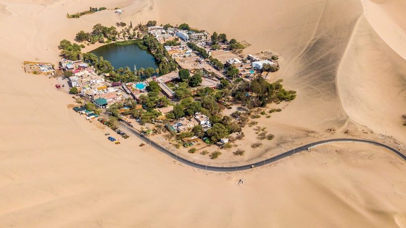 building exterior, 1080P, water, aerial view, eye, scenics - nature, architecture, arid climate, sand, travel destinations, nature, tree, high angle view
