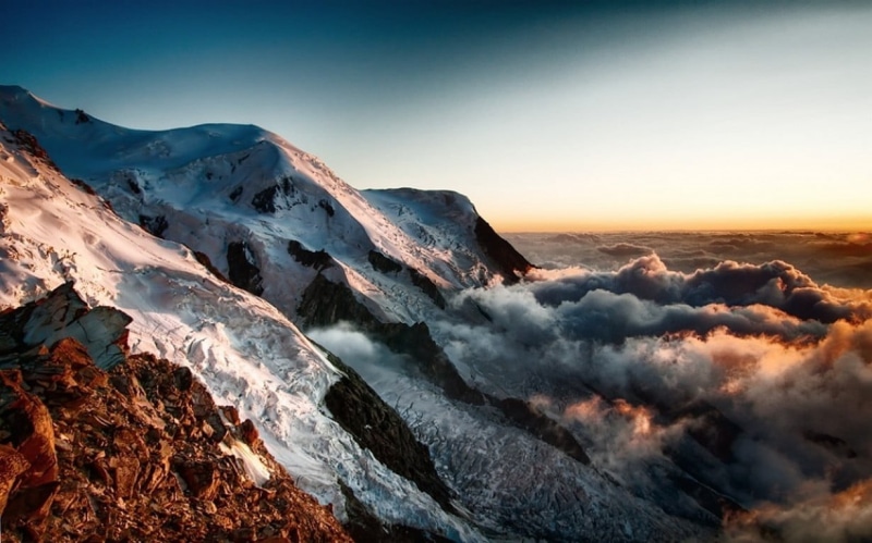 outdoors, mountain range, non-urban scene, idyllic, snow, winter, coated, summit, clouds, fog, sunset, sun, sky, environment, beauty in nature, mountain