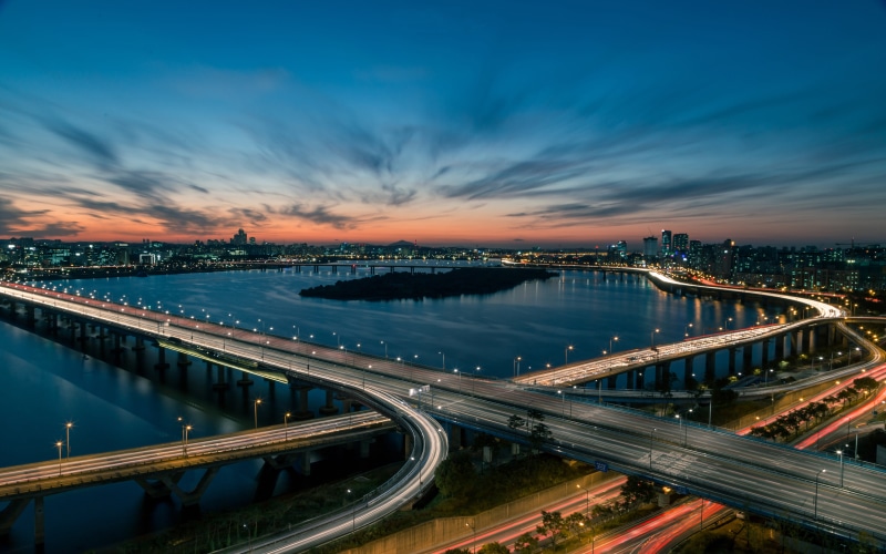 transportation, water, high angle view, illuminated, cloud - sky, river, nature, building exterior, bridge - man made structure, night, architecture, connection