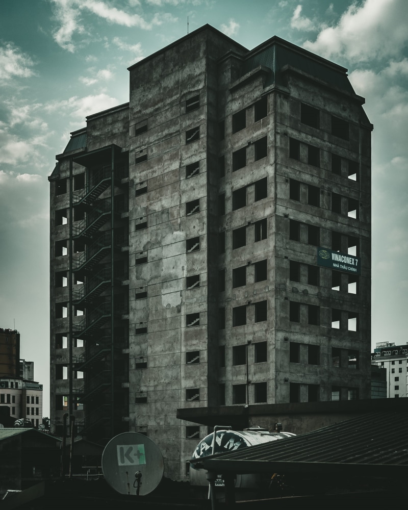 residential district, drama, building, abandoned, sky, built structure, tall - high, city, architecture, office building exterior, haunt, nature, dramatic sky