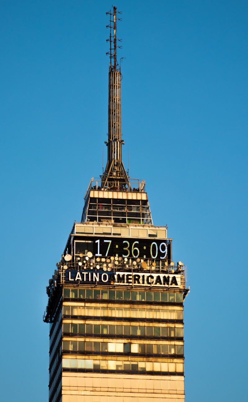 mexico city, outdoors, architecture, built structure, sky, spire, day, city, building, low angle view, communication, tall - high, no people, torre latino