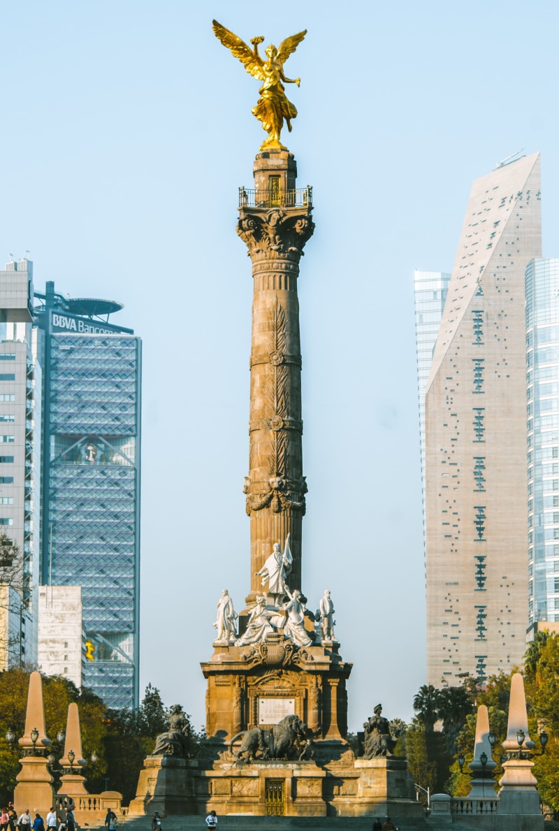 travel destinations, sculpture, belief, monument, spirituality, art and craft, city, architectural column, representation, statue, religion, travel, independence