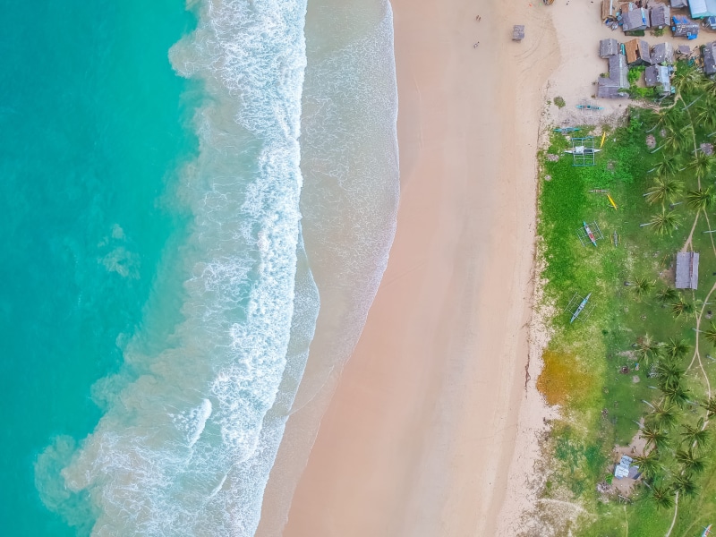 tranquility, water, aerial, shore, land, green color, no people, sport, sand, nature, high angle view, ocean, plant, outdoors, aerial view, drone, view