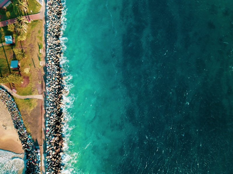 trip, seashore, scenic, people, sea, human body part, tranquility, beauty in nature, day, beach, leisure activity, road, drone shot, travel, high angle view