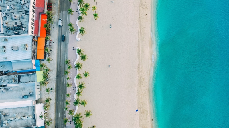 sea, no people, vacation, beauty in nature, day, sand, high angle view, building exterior, florida, 2K, plant, turquoise colored, building, blue, aerial