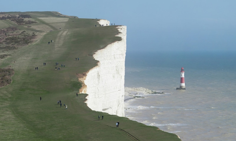 building exterior, architecture, cliff, tranquil scene, day, water, tranquility, lighthouse, beach, Cliffs of Dover, travel destinations, scenics - nature