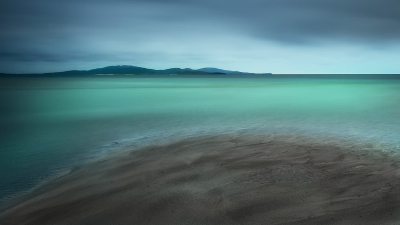 beauty in nature, non-urban scene, cyan, idyllic, landscape, cloud - sky, mountain range, turquoise, blue, no people, remote, horizon, sea, day, nature