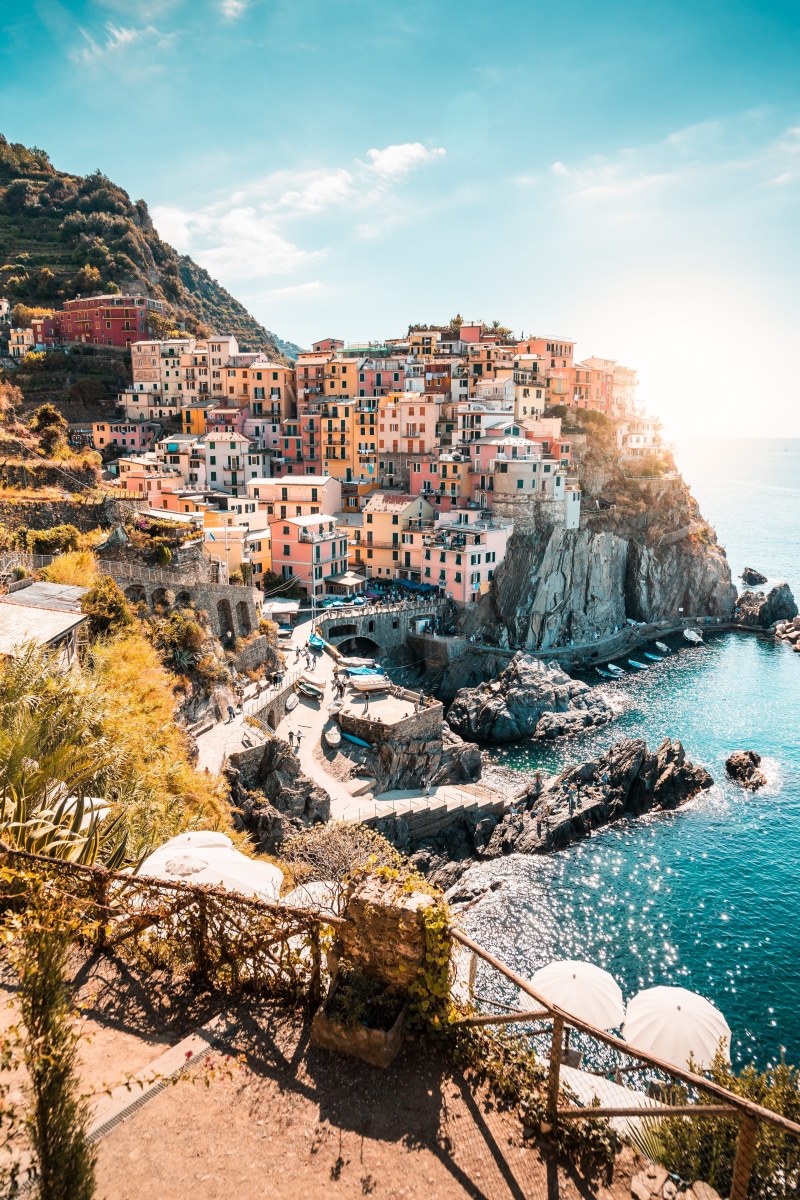 sunny, architecture, solid, traveling, water, rocks, built structure, rock, sea, coast, city, cinque terre, manarola, old, town, europe, scenics - nature