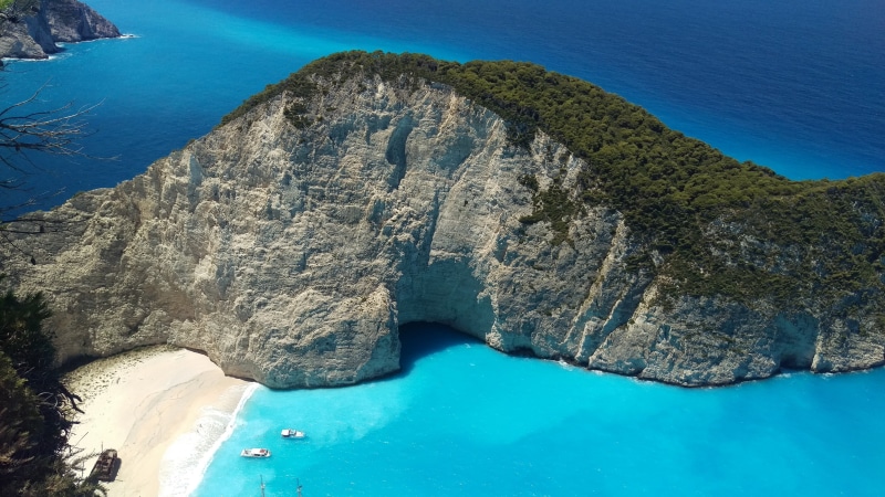 rock - object, idyllic, navagio beach, solid, coast, blue, arch, 4K, beauty in nature, rock formation, promontory, outdoors, rock, greece, shipwreck, nature
