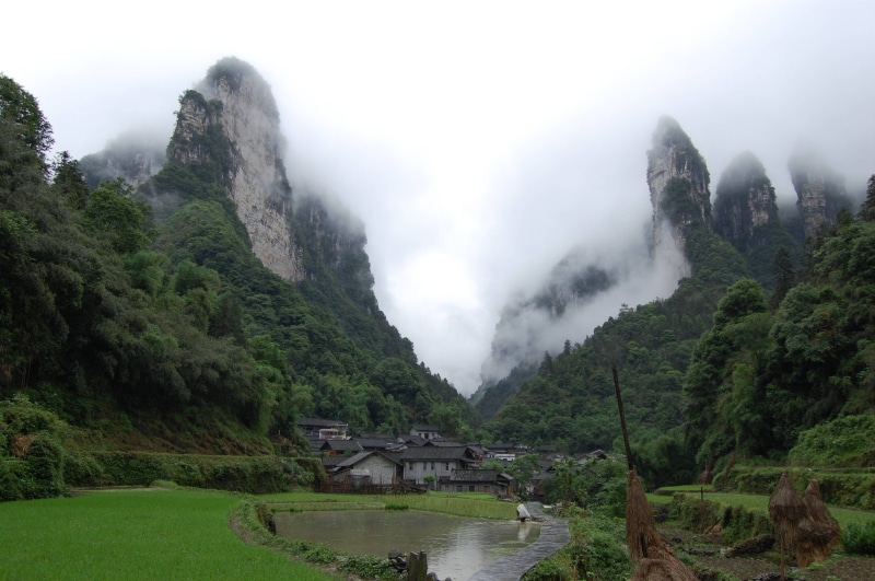 non-urban scene, sky, water, beauty in nature, scenics - nature, no people, outdoors, mountains, tranquil scene, architecture, plant, mountain range, Zhangjiajie National Park 