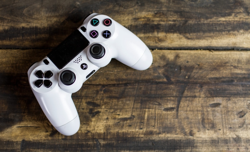fun, beige, studio shot, hand, day, television, no people, pad, wood - Material, metal, table, white color, photo, screen, top, player, console, view, flooring