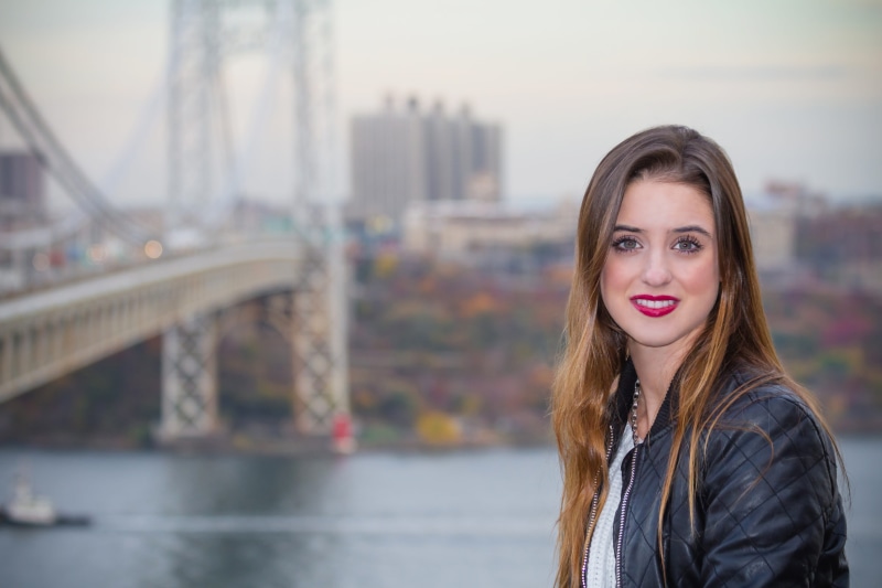 built structure, lifestyles, vacations, brown hair, hair, bridge, whit girl, jacket, taking, america, looking at camera, scenic, travel, architecture, adult