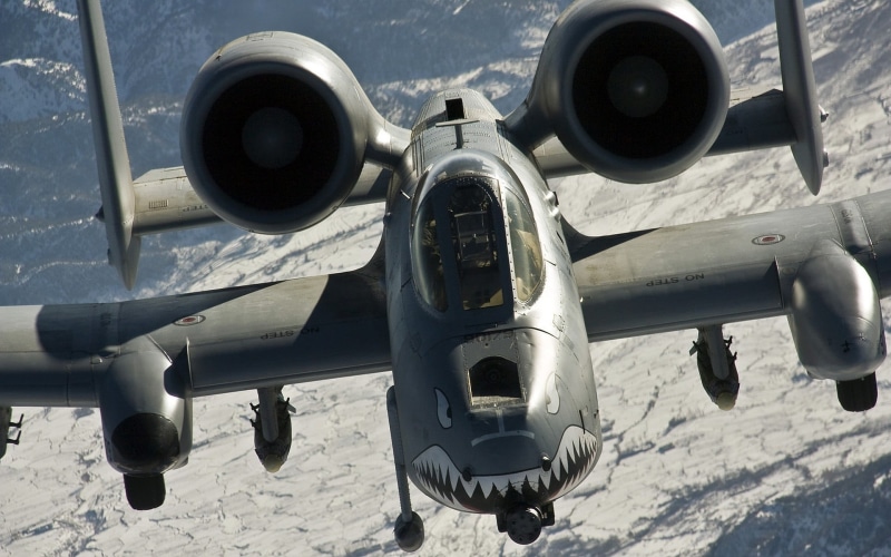 security, aircraft, air vehicle, sunlight, Fairchild A-10 Thunderbolt II, flying, airplane, high angle view, no people, black, mode of transportation, outdoors