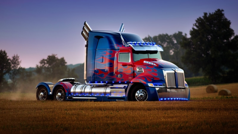 day, motion, grass, car, transportation, motor vehicle, sky, transport, copy space, optimus prime, outdoors, land vehicle, trailer truck, no people, plant