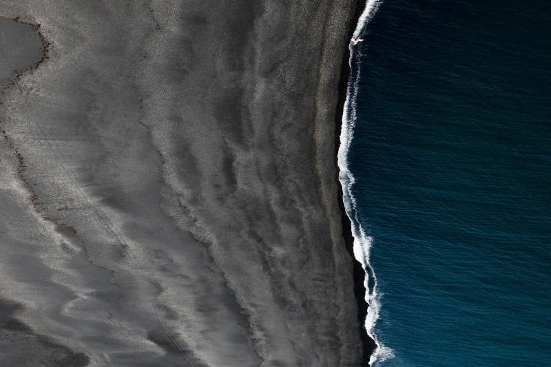 tranquility, beach, scenics - nature, pattern, wave, water, nature, landscape, aquatic sport, birds eye view, high angle view, sport, motion, black sand