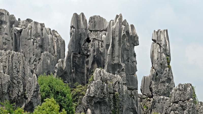 rock needles, travel destinations, formation, beauty in nature, stones, skies, tree, karst, rock formation, day, cloud - sky, scenics, rock - Object, eroded