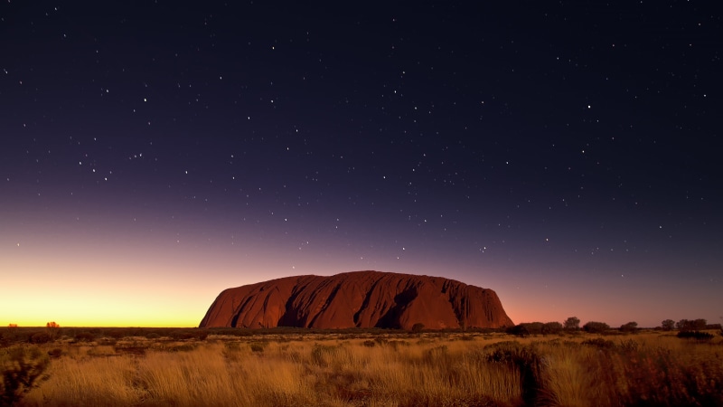 travel destinations, dark, North, planet - Space, Ayers Rock, blue, light - Natural Phenomenon, dusk, non-urban scene, rock, Sandstone, rock formation