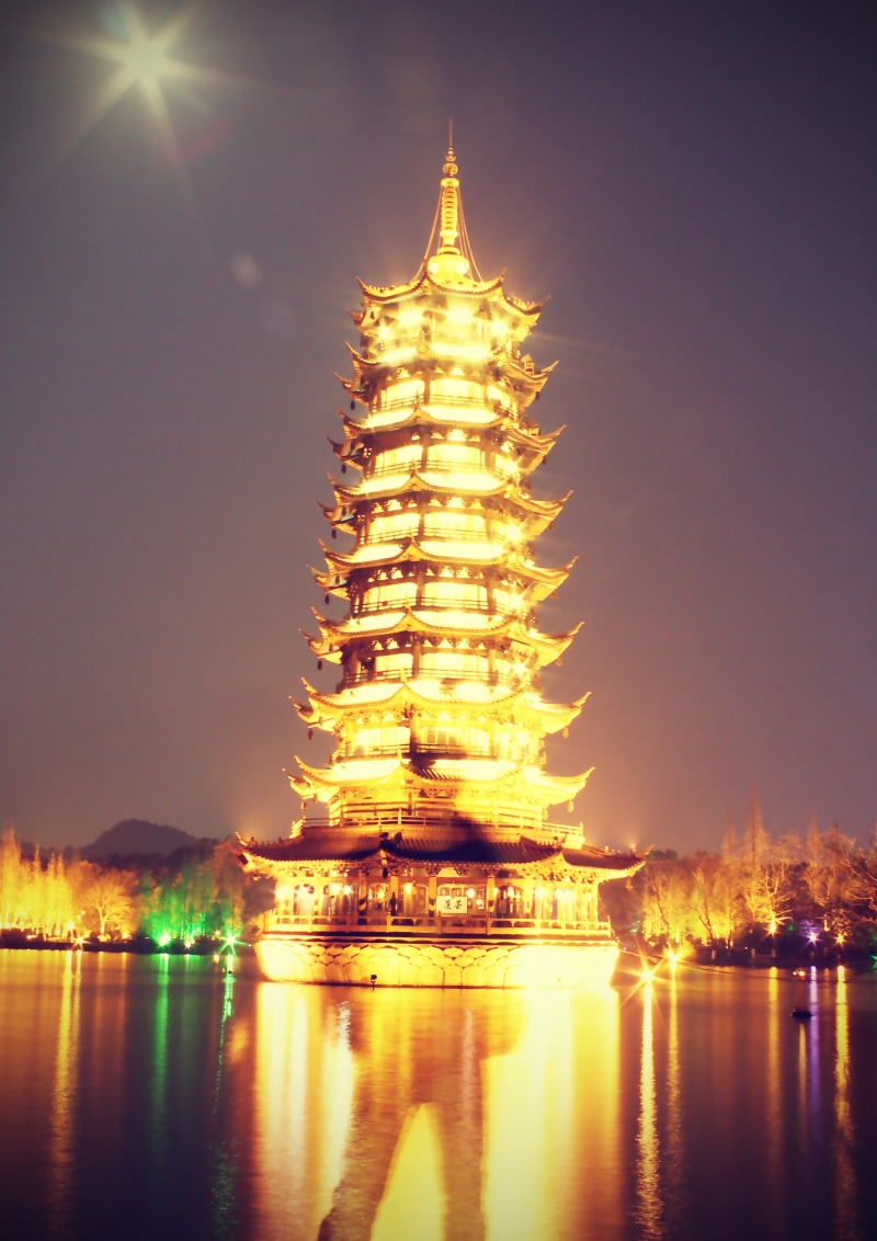 history, brown, spirituality, sky, building exterior, reflection, religion, built structure, outdoors, 2K, pagoda, belief, illuminated, no people, place of worship